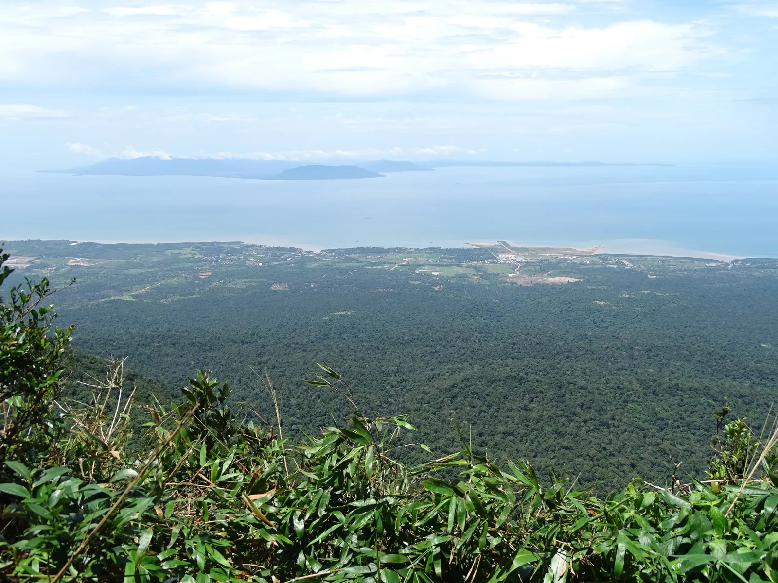 Sweeping view over forested hills and coastline from Bokor Hill Station near Kampot, Cambodia.