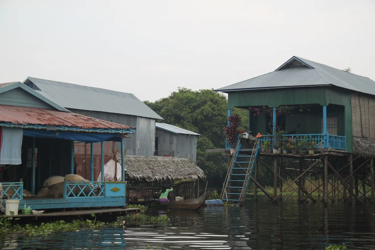 Stilt houses with painted wooden facades rise above the water at Tonle Sap Lake near Siem Reap.