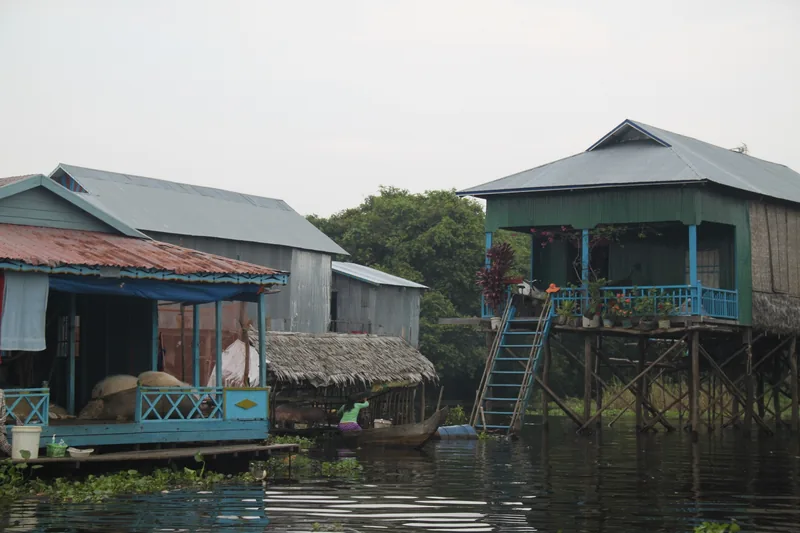 Stilt houses with painted wooden facades rise above the water at Tonle Sap Lake near Siem Reap.