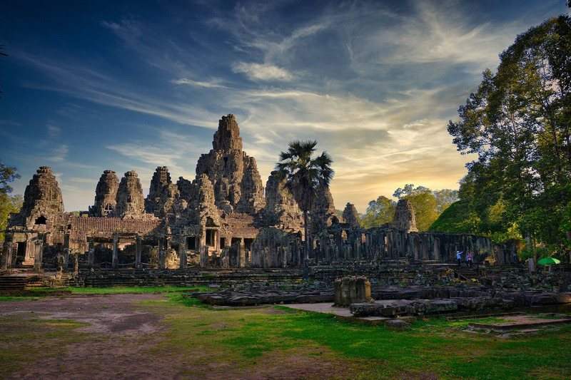 The stone faces of the Bayon temple at dusk