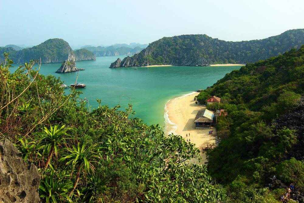 Sheltered cove with clear water and forested headlands
